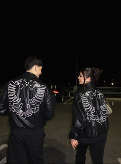 Couple wearing matching Albanian Red Eagle Jackets — Hajde Zemer