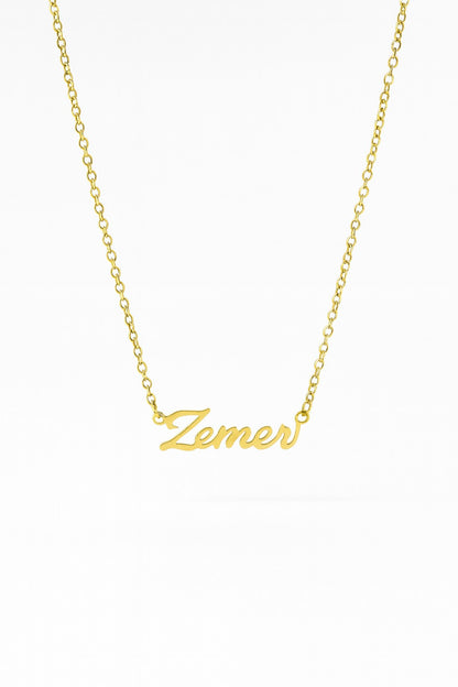 Gold necklace with 'Zemer' pendant on a white background