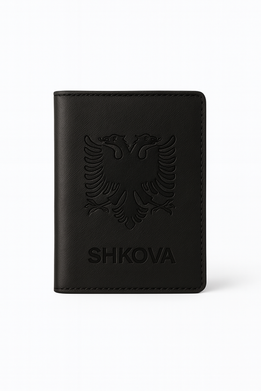 Black leather wallet with embossed design and 'SHKOVA' branding on a white background