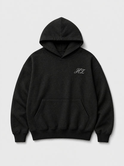 Hajde Zemer HZ Essential Eagle Hoodie in black, front flat lay with white HZ script