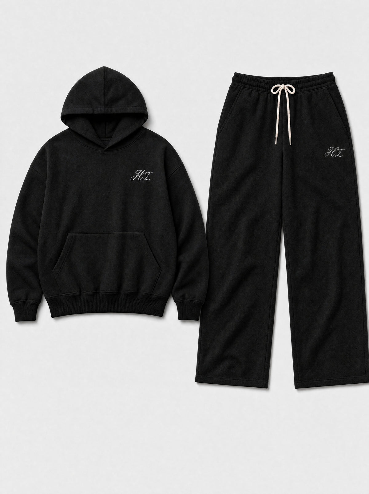 Hajde Zemer HZ Essential Eagle Set in black, hoodie and sweatpants laid side by side