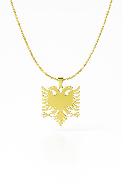 Gold necklace with an eagle pendant on a white background