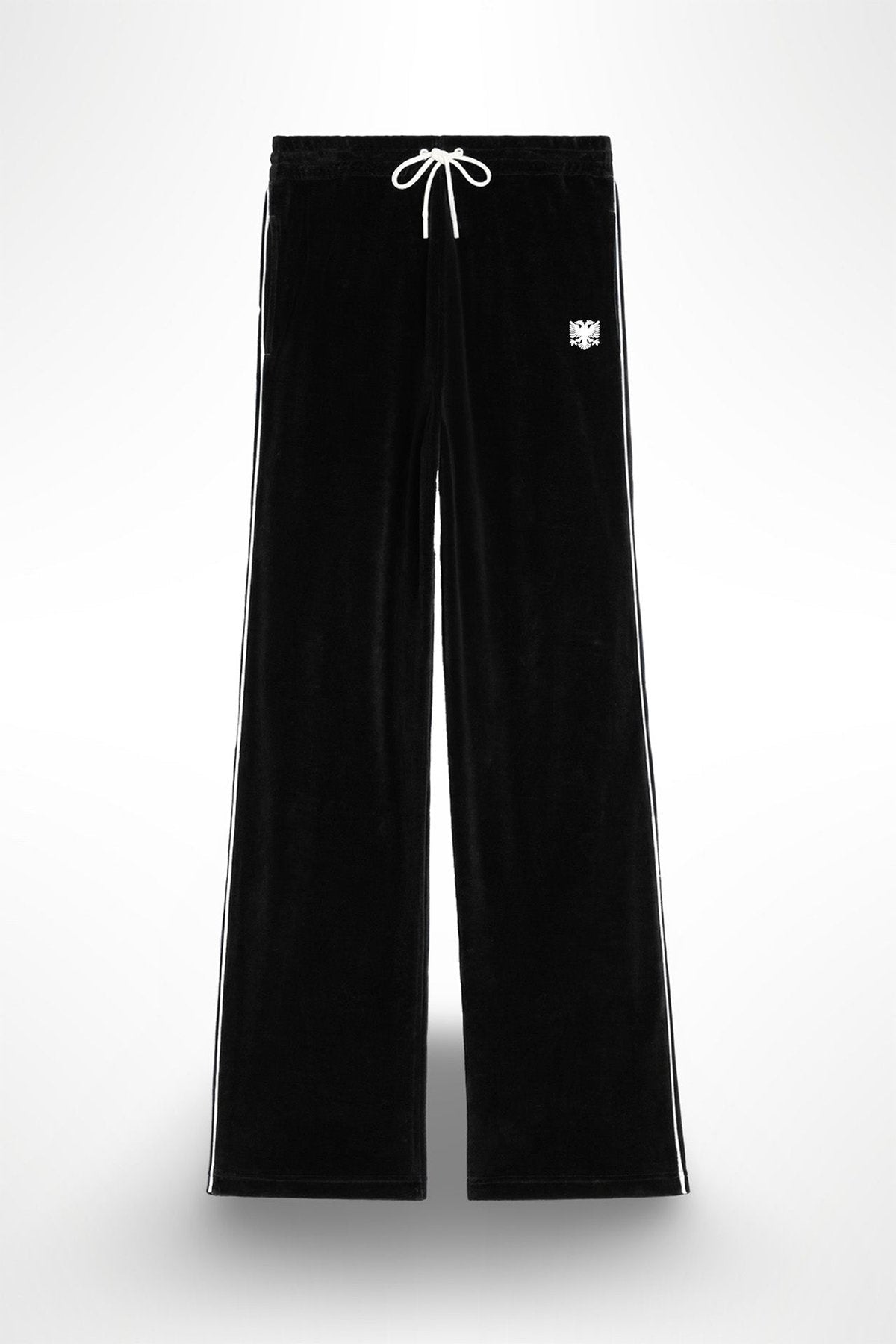 A pair of black velour pants with white stitching and an eagle applique on the left leg, featuring a drawstring waistband.
