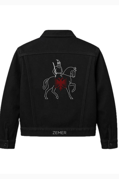 Black denim jacket with embroidered design on the back, brand 'Zemer' visible.