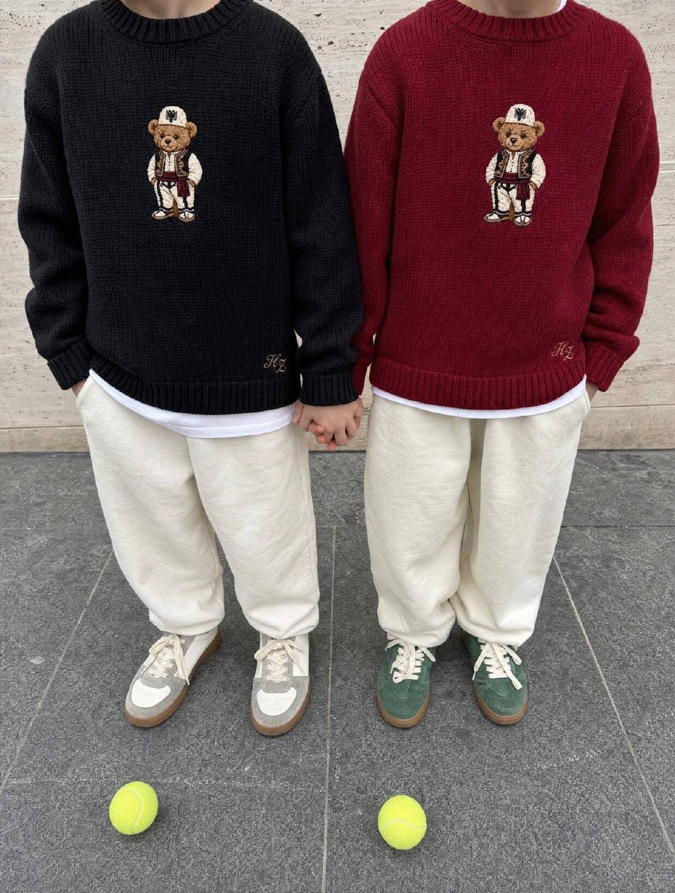 Albanian Ted Dua Bear Sweater Set for kids (Black + Burgundy), two children side by side in the black and burgundy knits