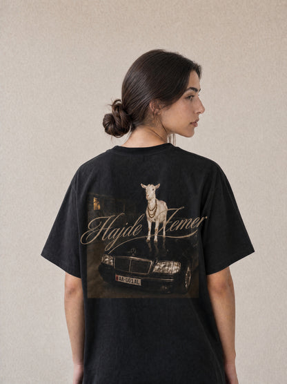 Woman wearing the Hajde Zemer black goat tee, back view showing the print