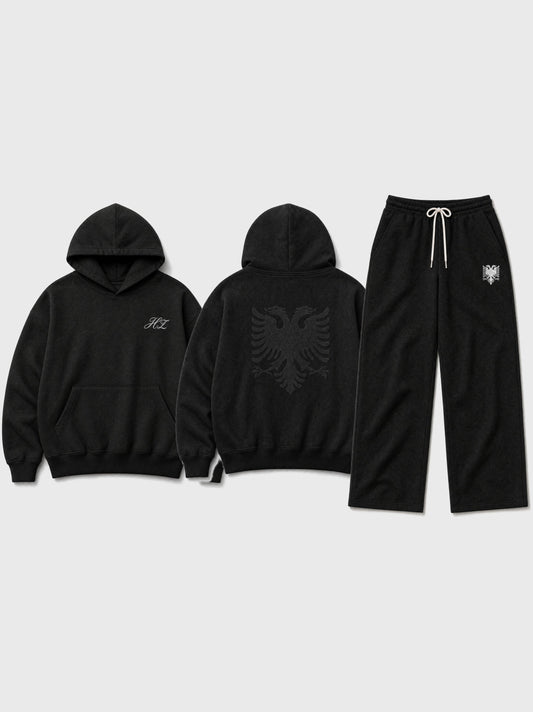 Design preview: Hajde Zemer HZ Essential Eagle Set in black, flat lay - hoodie front with the HZ script, hoodie back with the double-headed eagle, and the matching sweatpants with the cream eagle at the hip