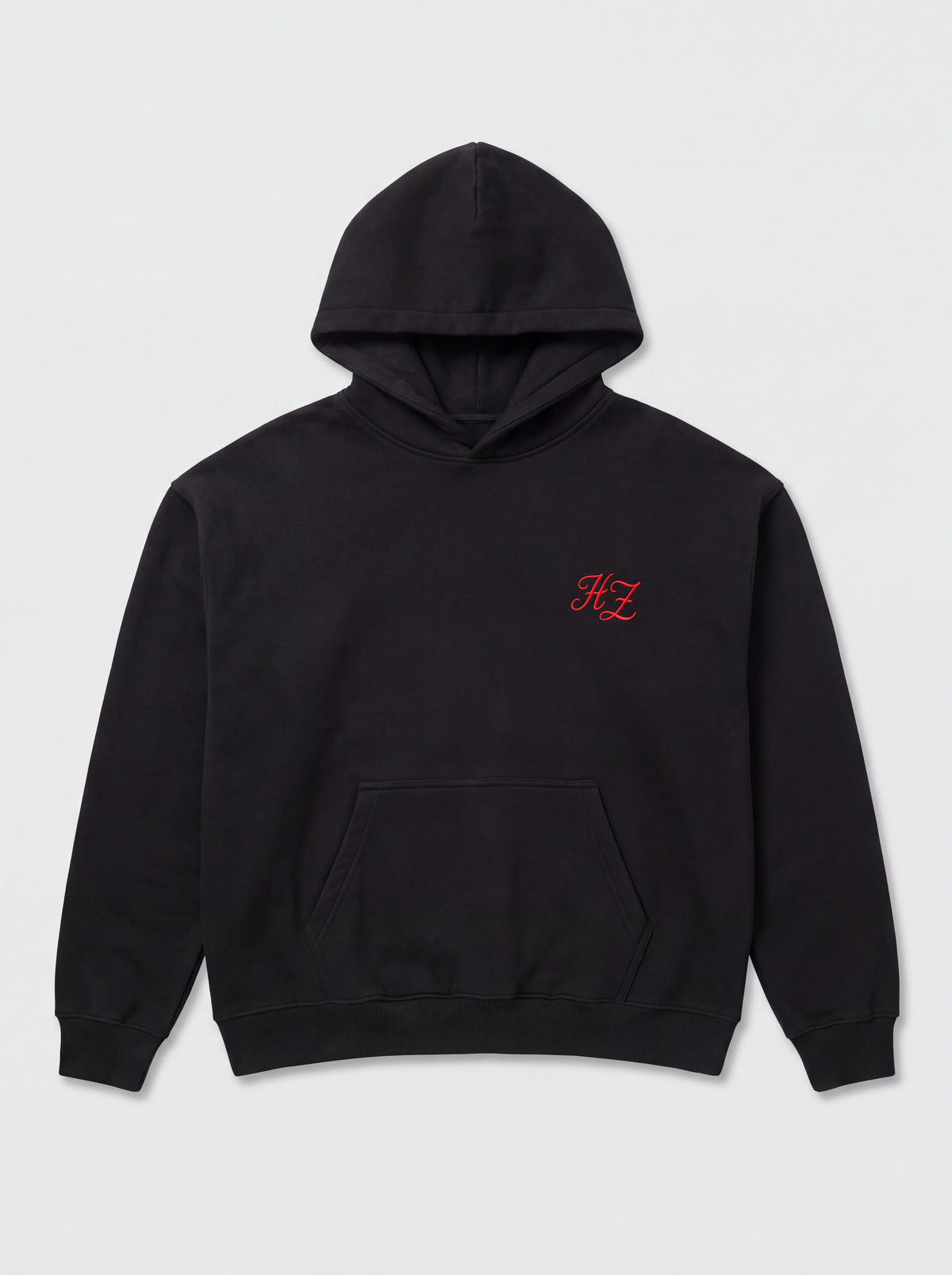 Hajde Zemer Essential Eagle hoodie in black, laid flat, front view, with a small red HZ mark on the chest