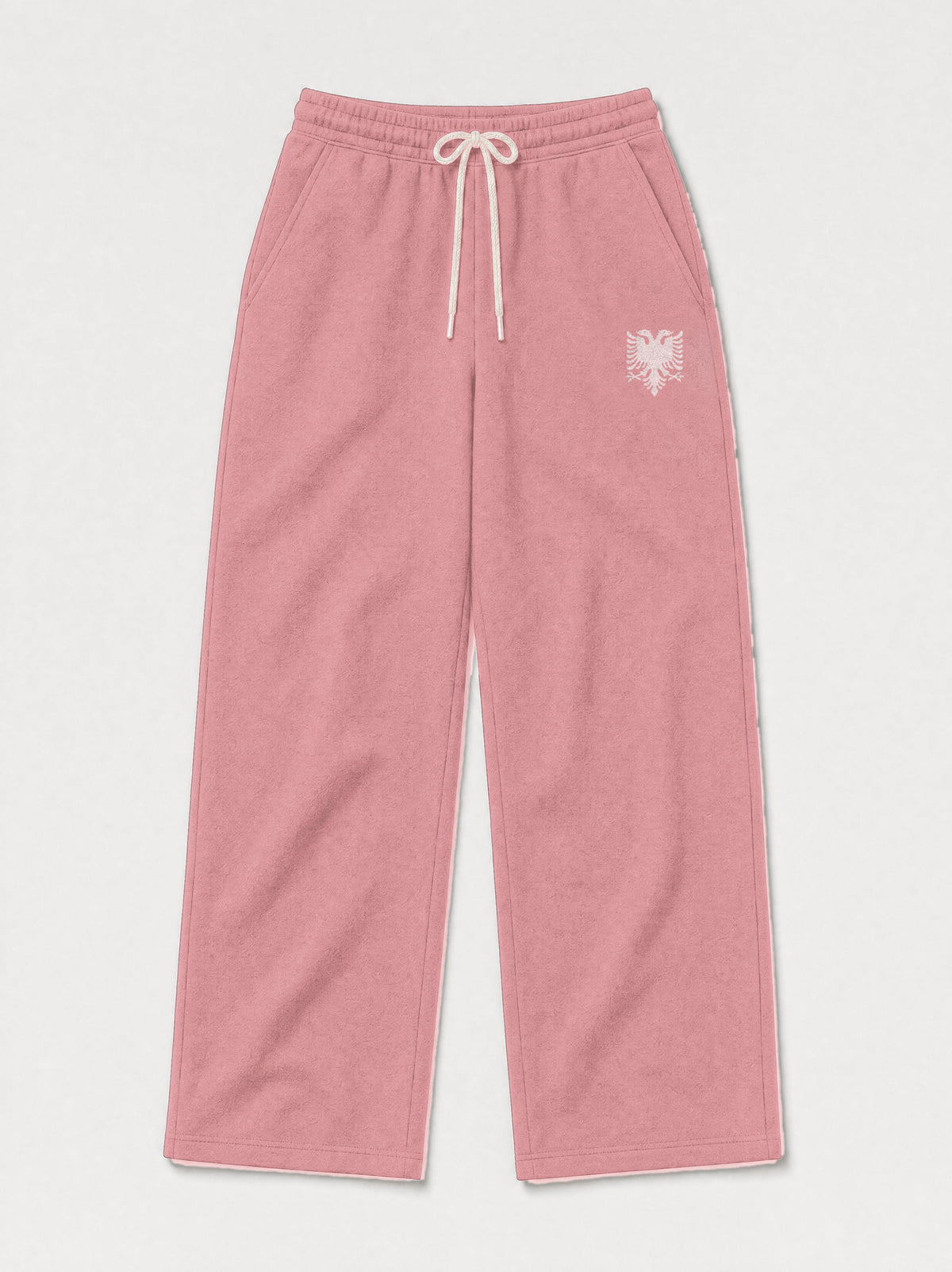 Design preview: Hajde Zemer HZ Essential Eagle Sweatpants in dusty rose pink, front flat lay with the cream drawcord and the cream double-headed eagle at one hip