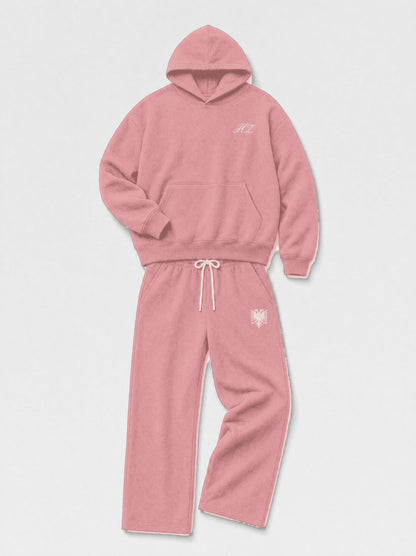 Design preview: Hajde Zemer HZ Essential Eagle Set in dusty rose pink, folded flat lay with the cream eagle at the sweatpant hip