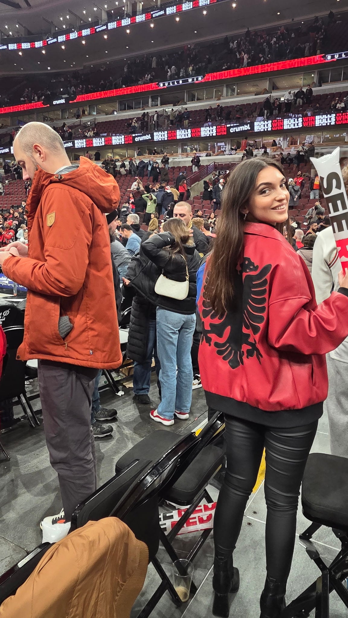 UGC - Abetare wearing Red Eagle Jacket at Bulls game