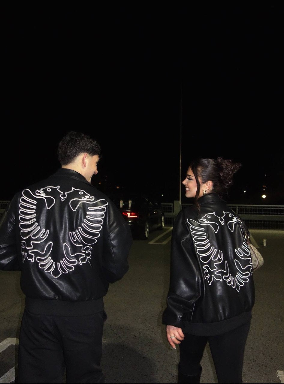 Couple wearing matching Albanian Eagle Jackets