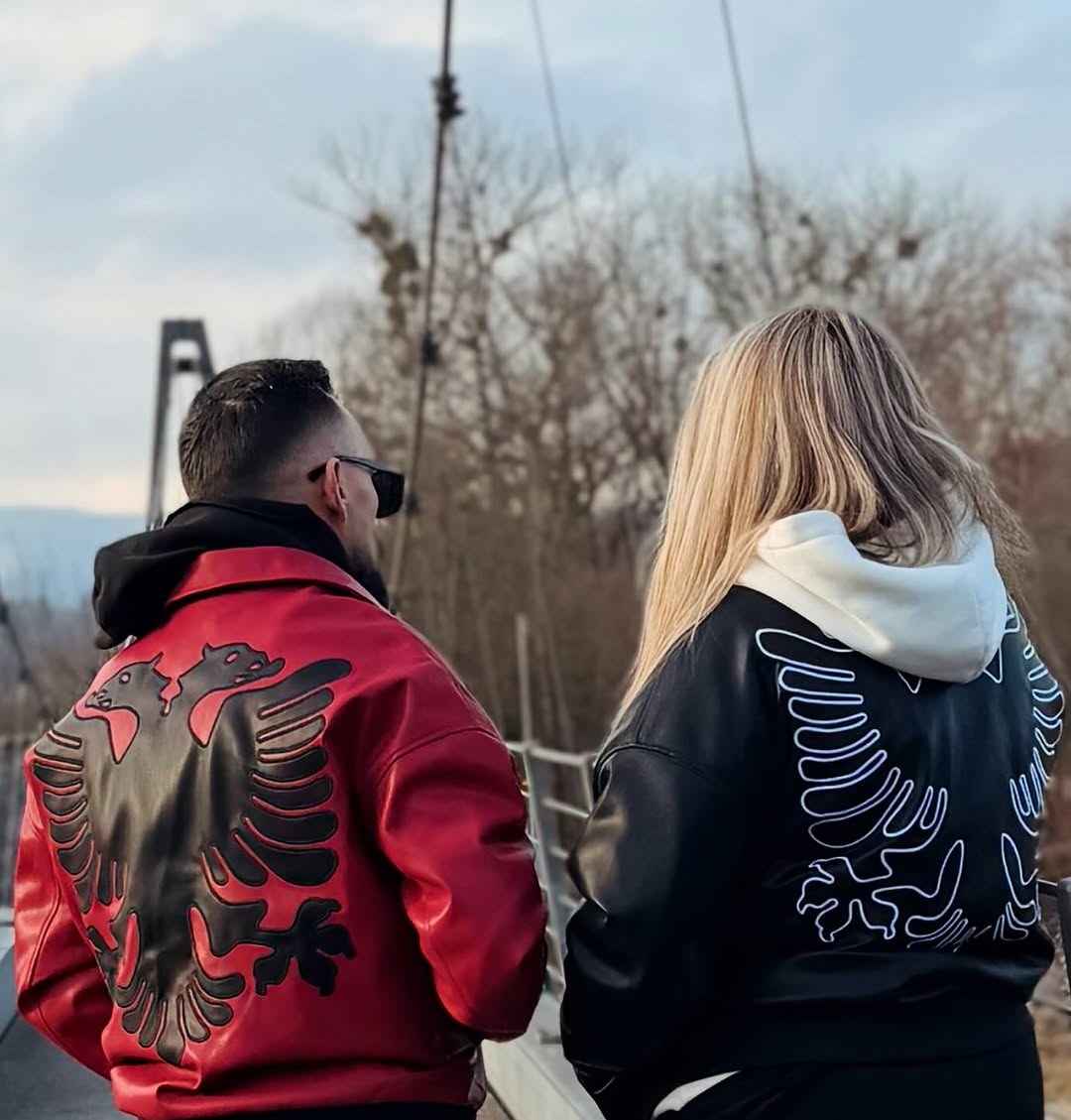 UGC - Couple wearing Red and Black Eagle Jackets on bridge