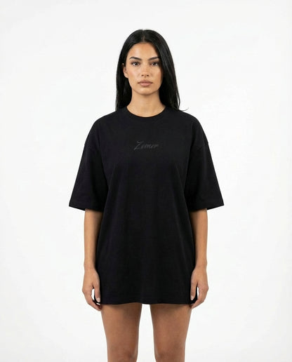 Zemer Script Tee - Women's oversized fit front view, black tee with centered tonal Zemer script