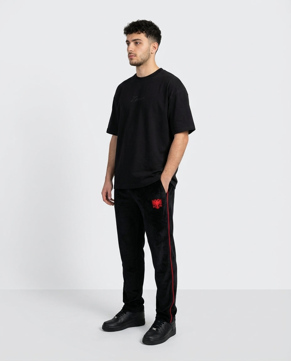 Zemer Script Tee - Men's 3/4 side view with Velour Red Stitch pants